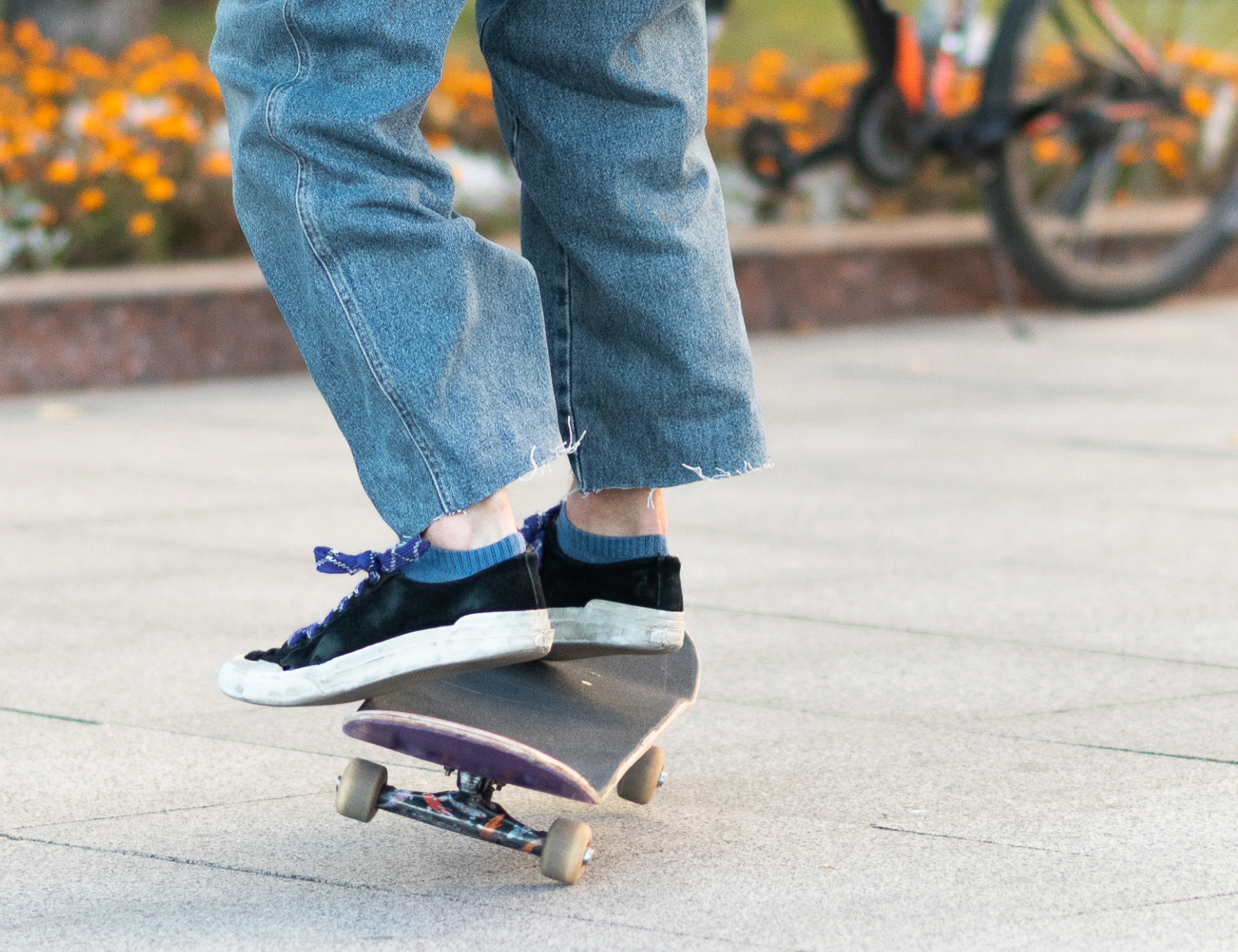 Close up of the feet of someone on a skateboard