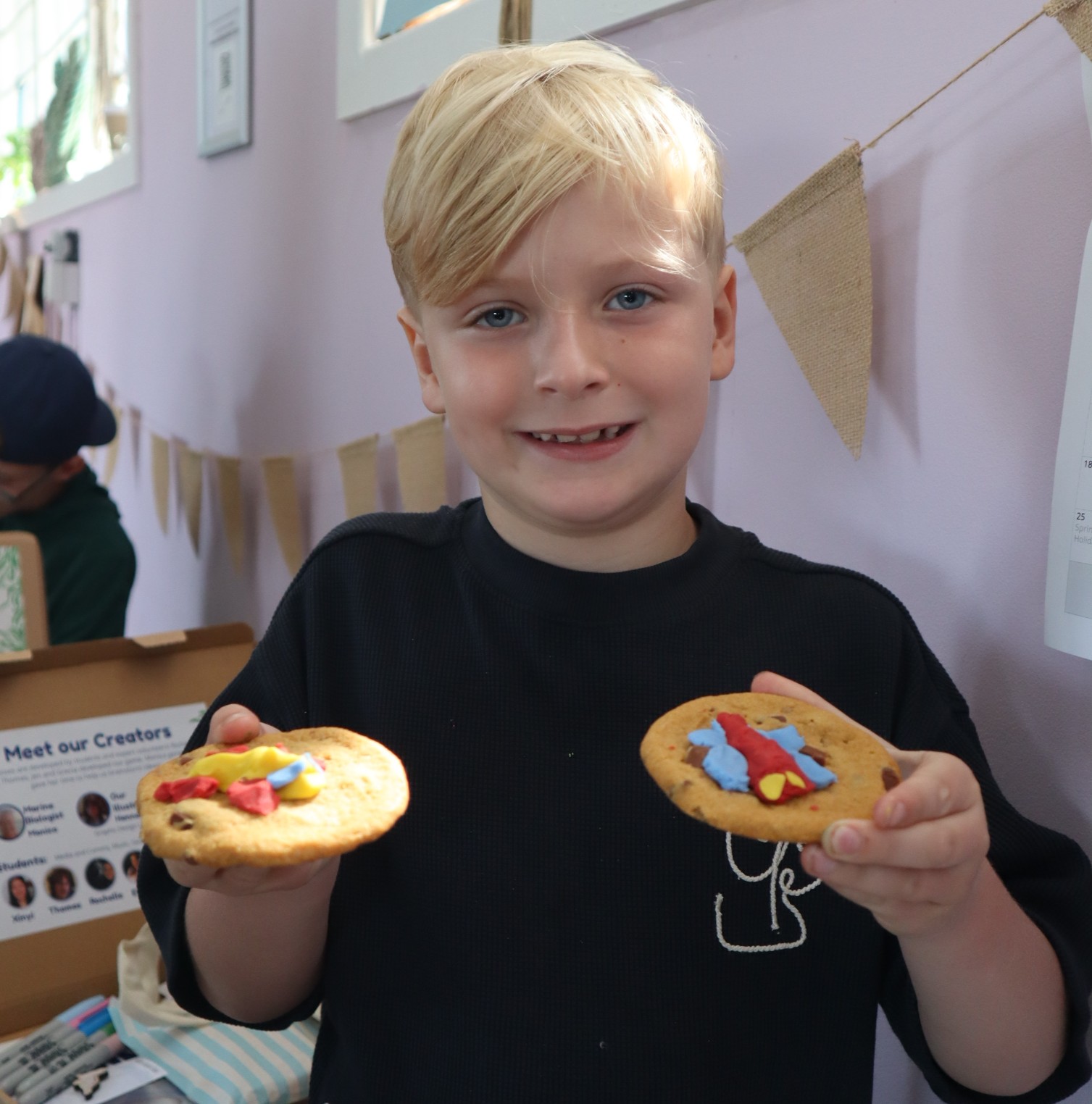 Kid holding a cookie