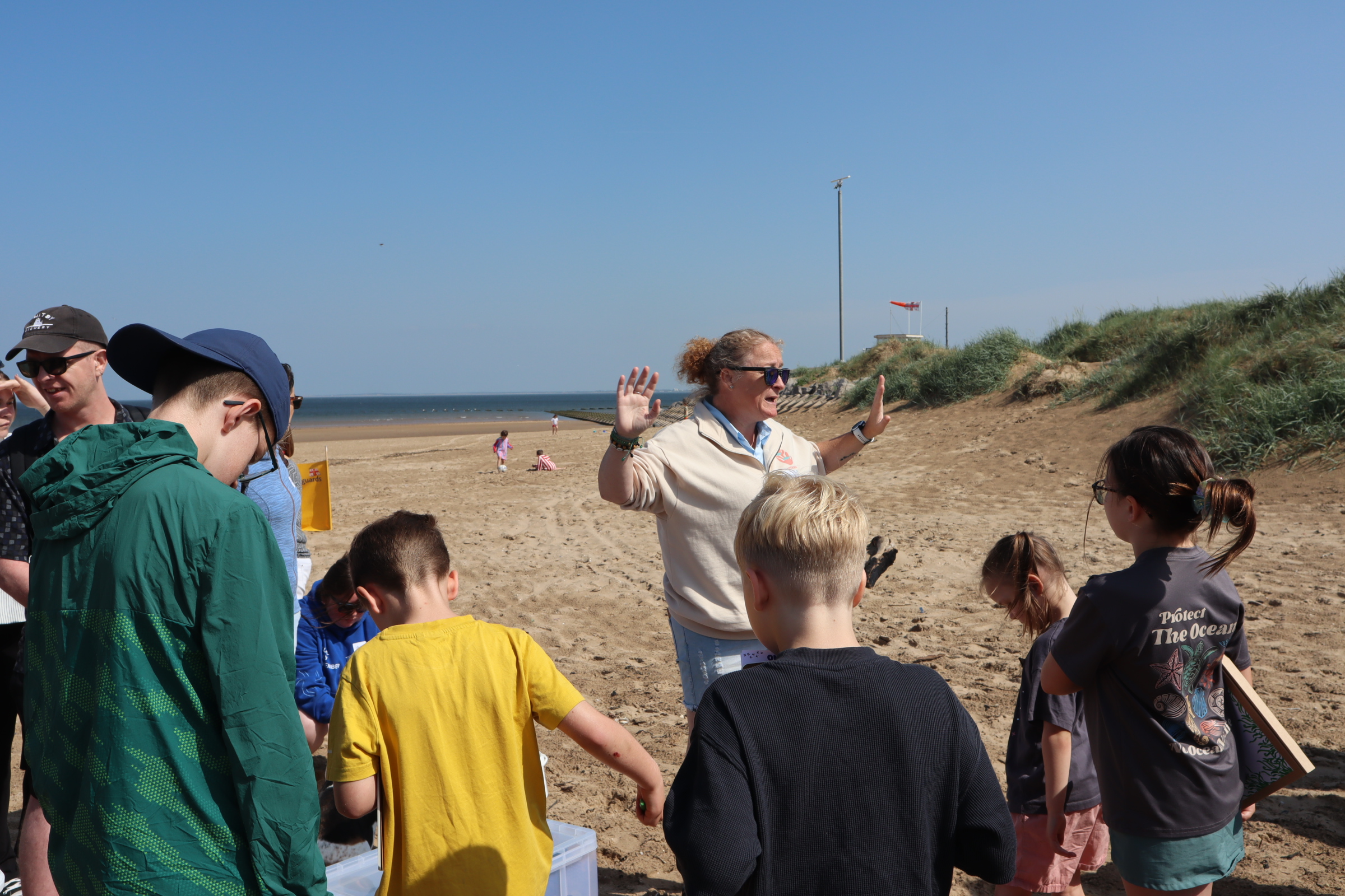 Dr. Monica McCard talking in the beach