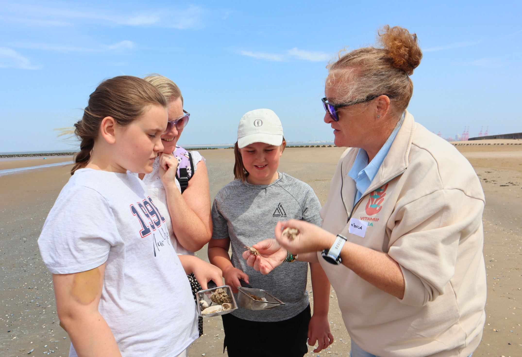 A marine biologist talking with children about marine wildlife