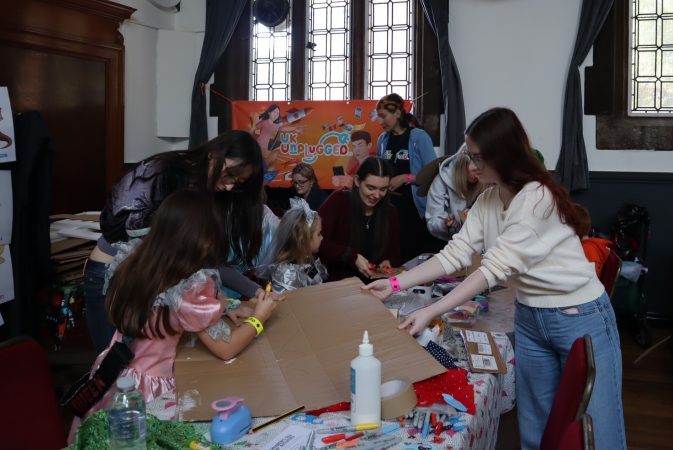 Volunteers helping children at Questival